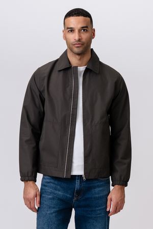 Trumpa striukė su užtrauktuku – tamsiai žalia